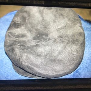 R O C this cap  is black and fax velour exterior and a fax fur interior.